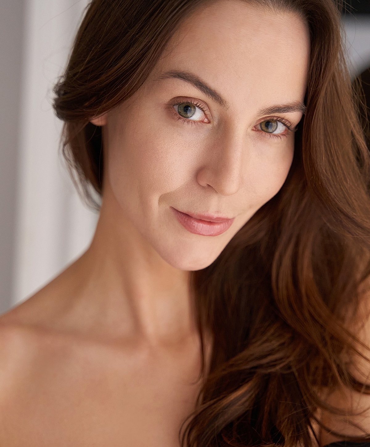 Portrait of a woman with long, brown hair.