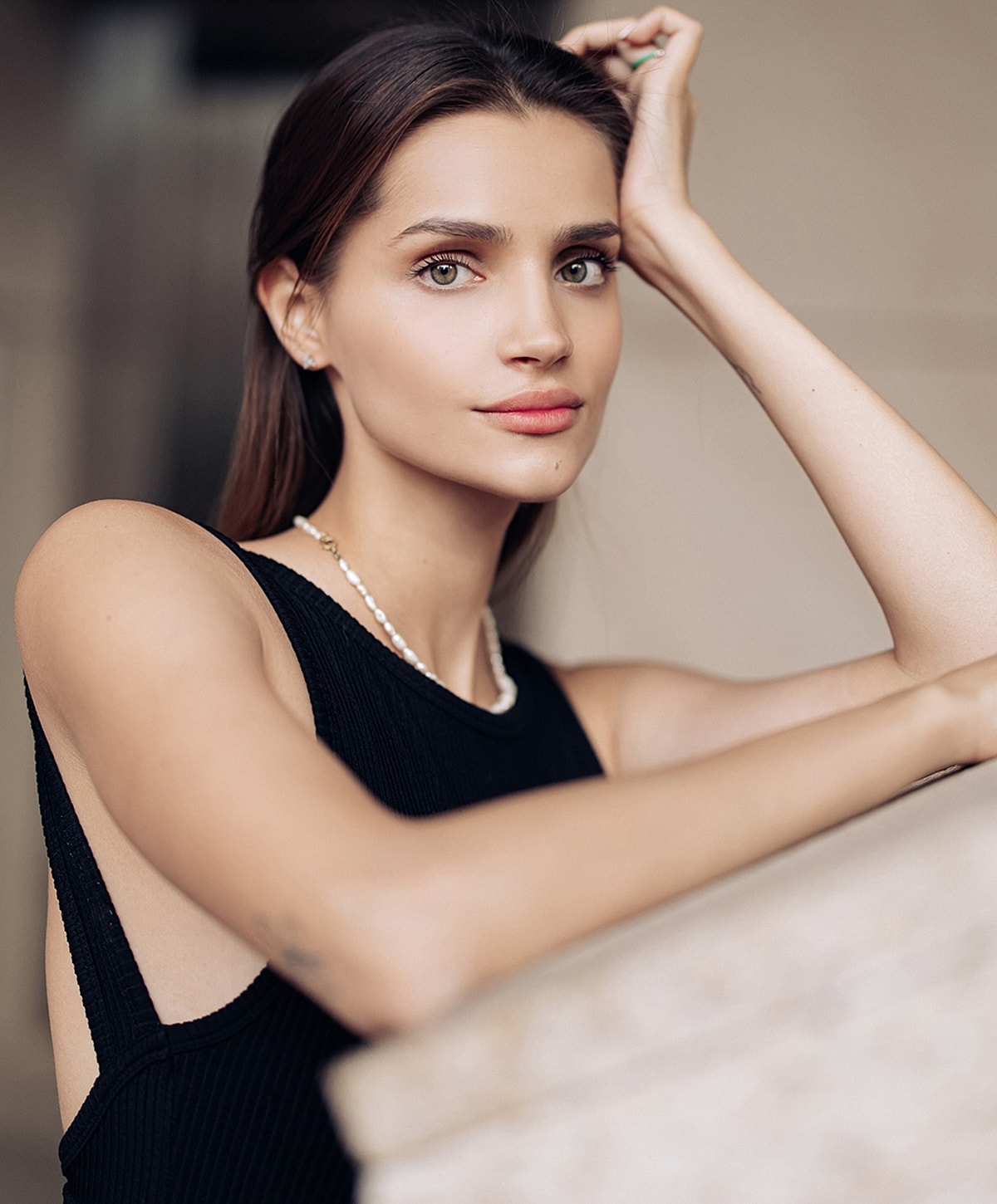 Portrait of a woman in a black outfit.