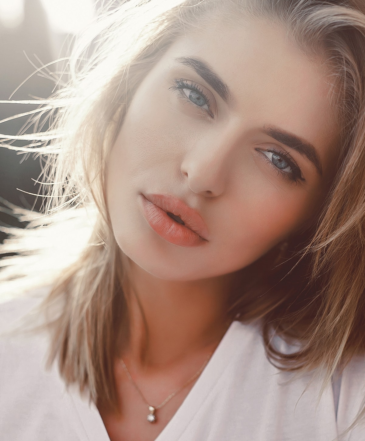 Close-up portrait of a woman with soft features.