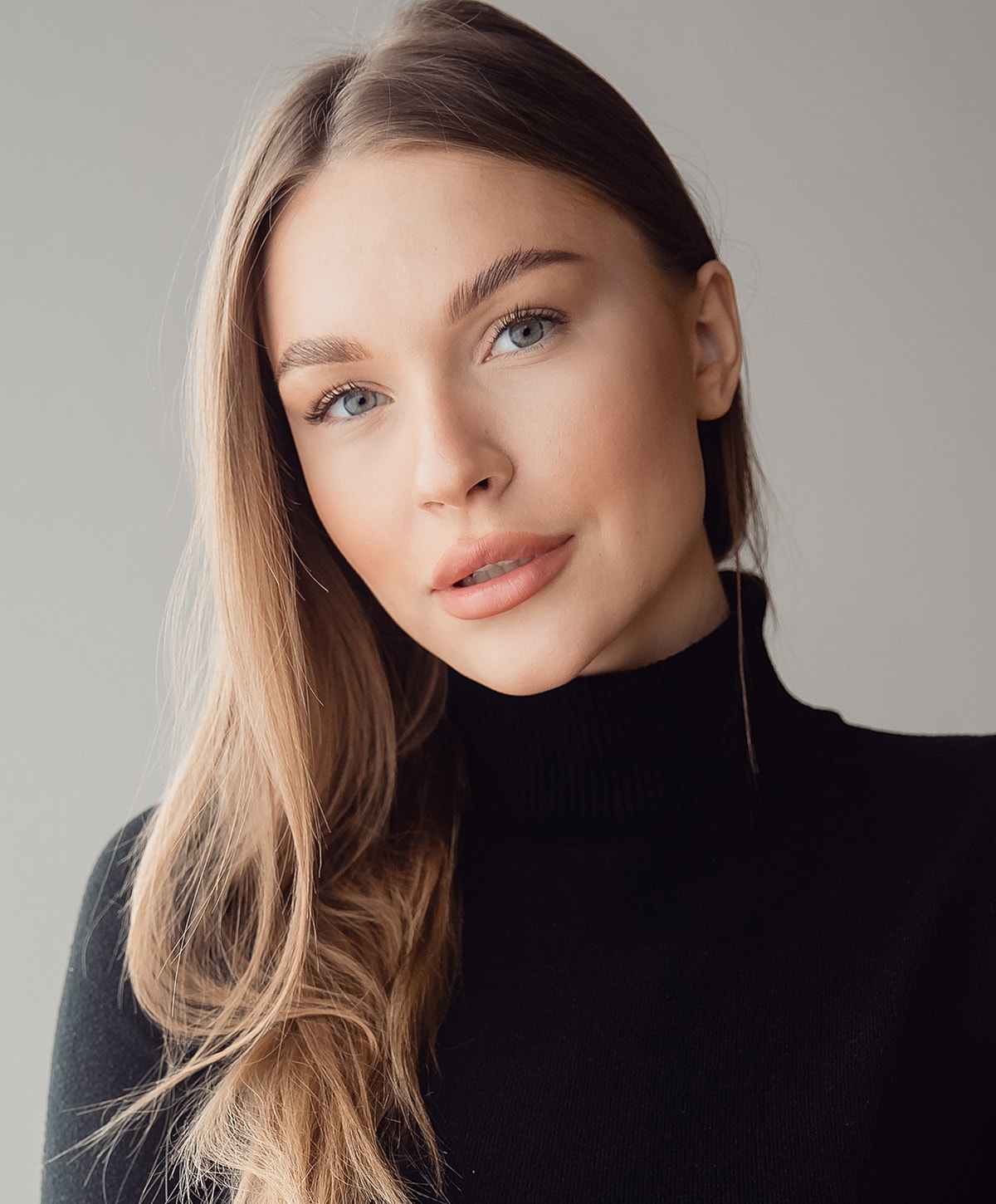 Portrait of a woman with long hair.